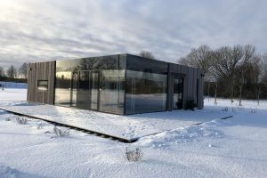 Wooden house with panoramic glass